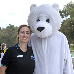 General Manager Calandra Barrett with Blades the Bear