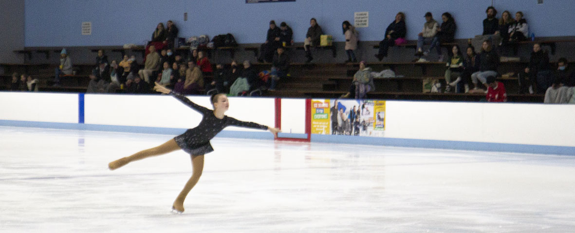 Figure skater performing at the Winter West Figure Skating Competition in 2022